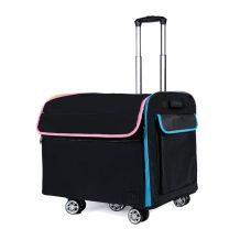 Rolling Goat™ 2.0 angled side view with extended handle, showing blue piping and exterior pocket on trolley with 360° wheels.