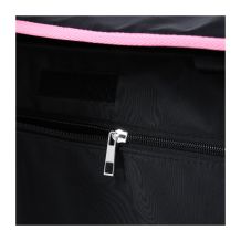 Close-up of Rolling Goat™ 2.0 interior zipper pocket with pink trim above and hook-and-loop closure panel.